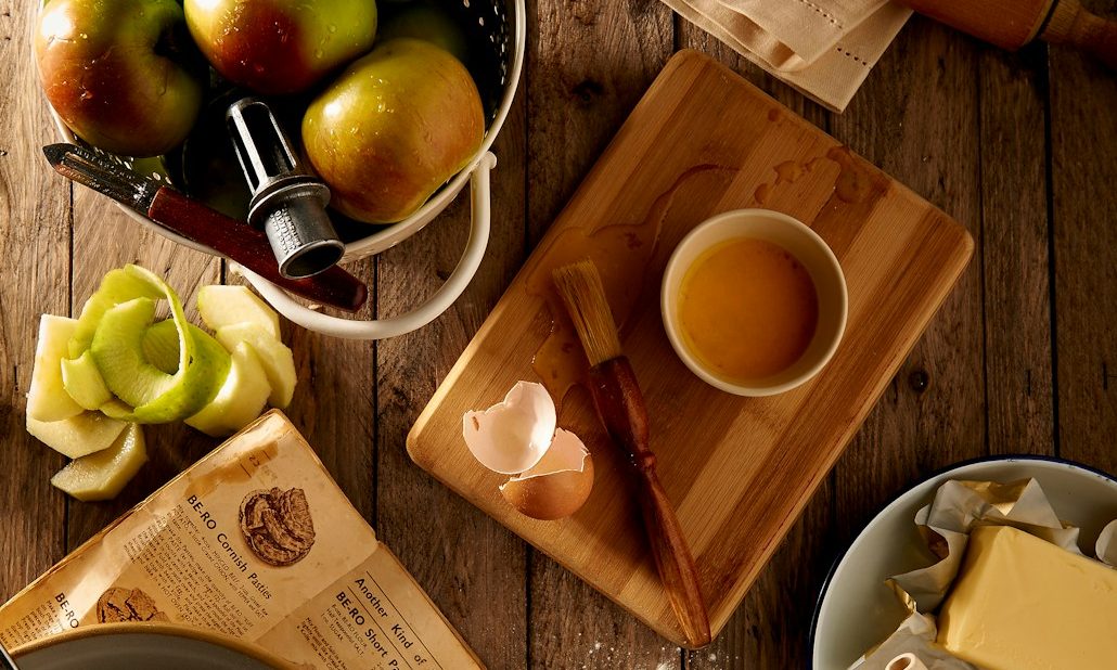 flat lay photography of mug on brown wooden chopping board